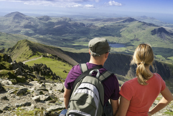 Couple enjoying view from top of Yr Wyddfa